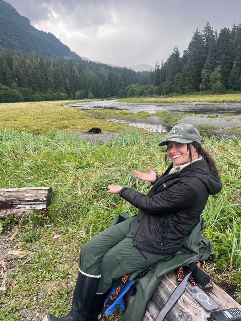 Former USFS Pack Creek Ranger and current Wild Coast Excursions Lead Guide Cam Ogden enjoys her favorite place, the viewing spit at Pack Creek, Admiralty Island, Alaska