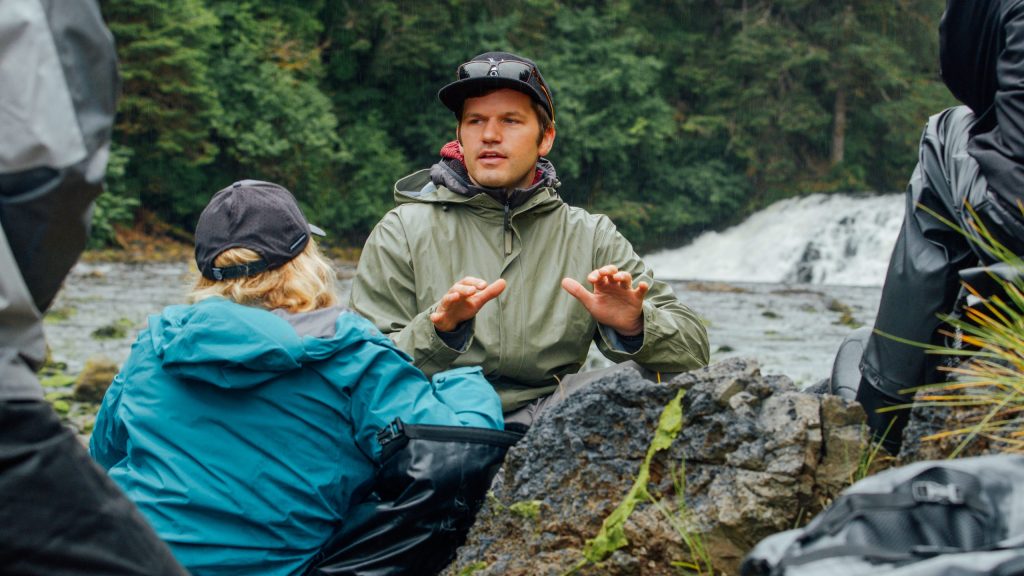 Lead guide briefing guests at Waterfall Creek during a private bear viewing trip.